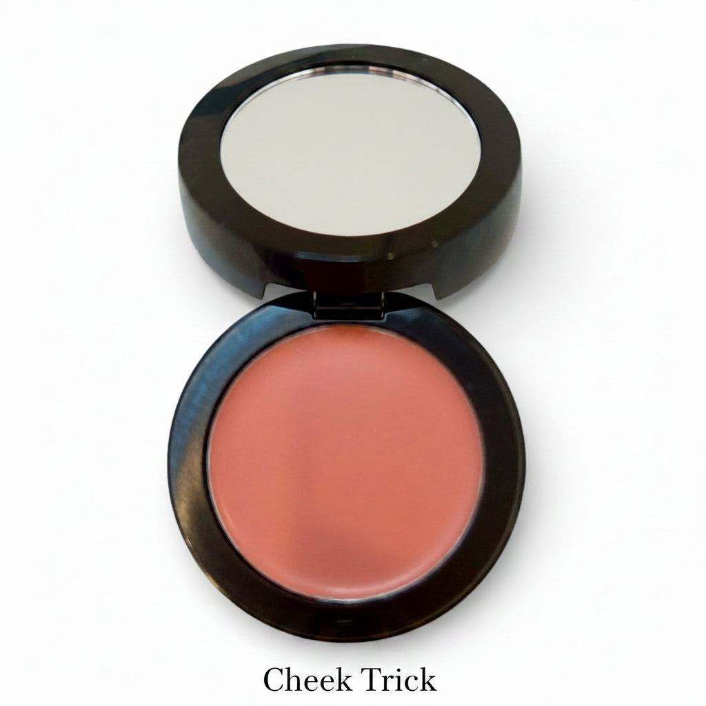 Compact blush with a visible brand logo on a white background