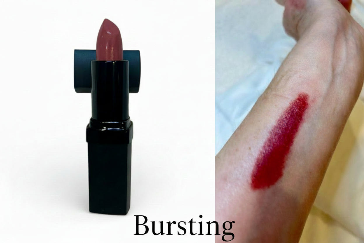 Lipstick with a swatch on skin, showing color application.