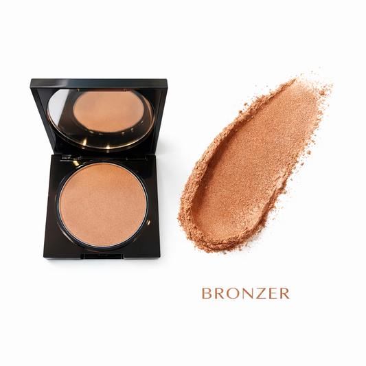 Compact bronzer with open case and swatch on a white background