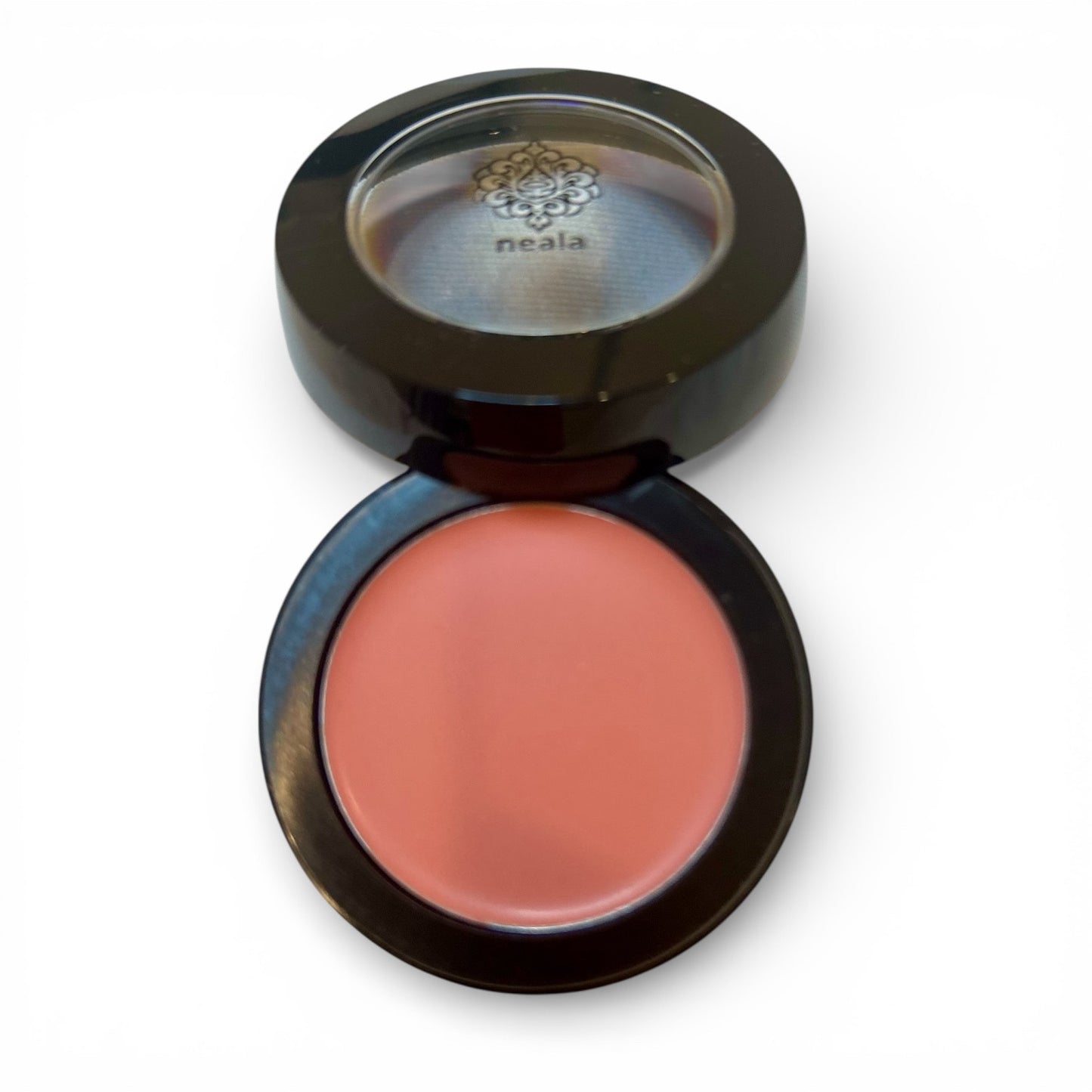 Compact blush with a visible brand logo on a white background