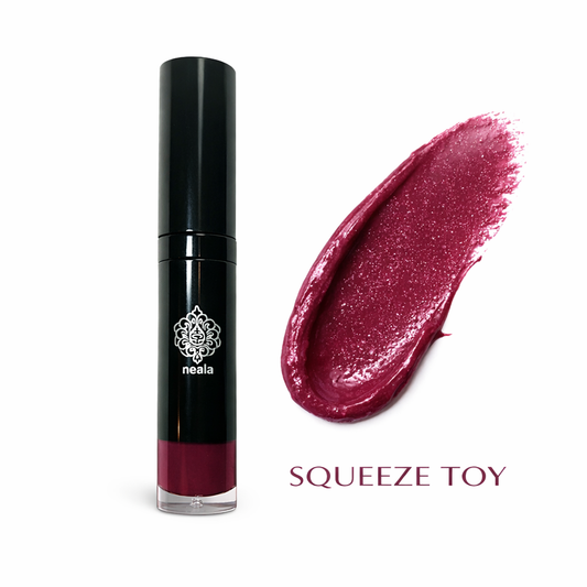 Black lipstick with a swatch of pink lipstick on a white background